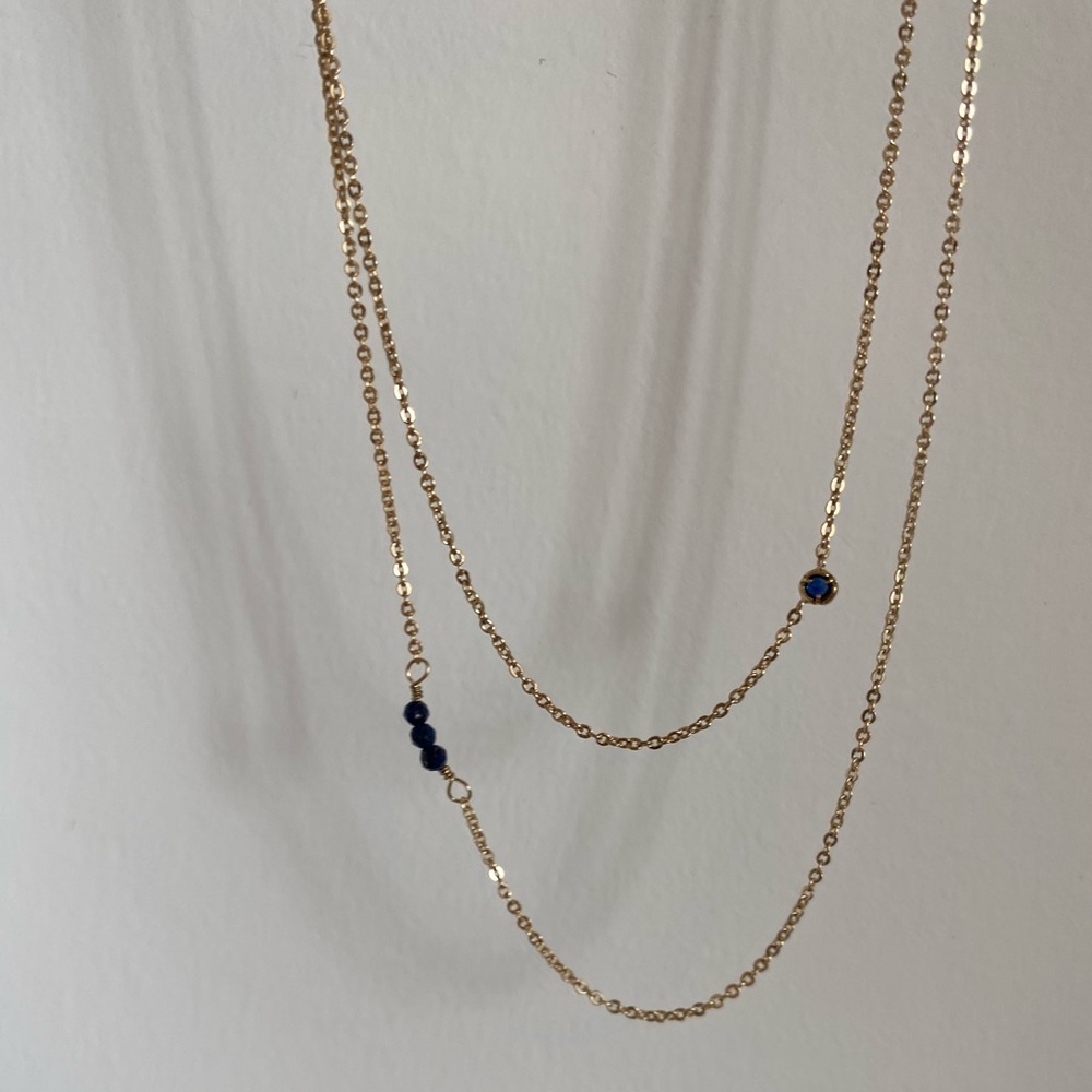 2 brand new gold necklaces with blue gems. Perfect condition never worn
